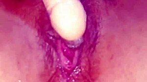 She boldly pleasures herself with a huge vibrator