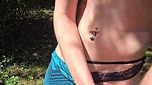 Wife sneaks quick handjob on walk flashing pierced nipples under skirt