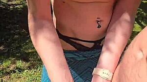 Wife sneaks quick handjob on walk flashing pierced nipples under skirt