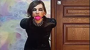 Bound crossdresser gagged in armbinder awaits his kinky twisted fate