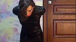 Bound crossdresser gagged in armbinder awaits his kinky twisted fate