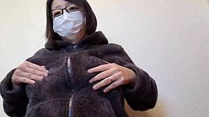 Married Japanese woman rubs big tits while masturbating fully