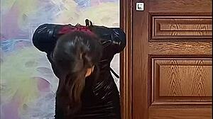 Bound crossdresser gagged in armbinder awaits his kinky twisted fate