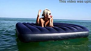 Isn't this tattooed blonde bitch's big boobs stunning on nude beach?