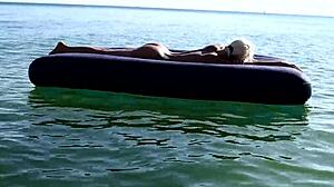 Isn't this tattooed blonde bitch's big boobs stunning on nude beach?