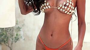 hey, watch this horny asian slut putri cinta strip off her orange bikini now!