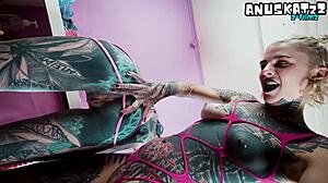 dominant tattooed goth lesbian pounds shaved pussy and ass with strapon