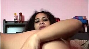 horny latina shakes ass with dildo on bed
