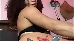 horny latina shakes ass with dildo on bed