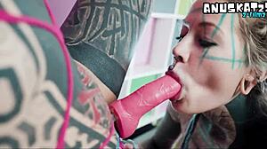 dominant tattooed goth lesbian pounds shaved pussy and ass with strapon