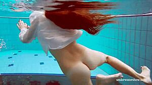 Lola's Big Natural Tits Bounce as Redhead Swims Underwater in Tight Pool