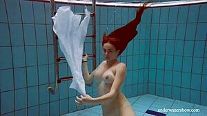 Lola's Big Natural Tits Bounce as Redhead Swims Underwater in Tight Pool