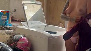 neighbor hides watching woman wash clothes freely with pussy and tits out in public outdoor spot