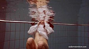 Lola's Big Natural Tits Bounce as Redhead Swims Underwater in Tight Pool