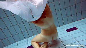 Lola's Big Natural Tits Bounce as Redhead Swims Underwater in Tight Pool