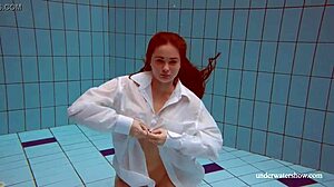 Lola's Big Natural Tits Bounce as Redhead Swims Underwater in Tight Pool