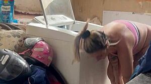 neighbor hides watching woman wash clothes freely with pussy and tits out in public outdoor spot