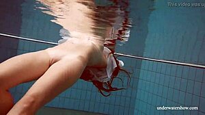 Lola's Big Natural Tits Bounce as Redhead Swims Underwater in Tight Pool