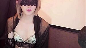 blindfolded crossdresser in lingerie strokes off