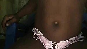 Stripping seductively in panties and bra tease