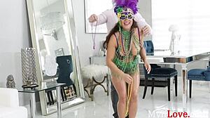 busty oiled brunette milf camela clutch flashes thick ass for mardi gras