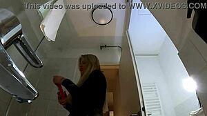 hot blonde babe strips pantyhose miniskirt high heels big tits ass bathroom tease