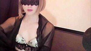 blindfolded crossdresser in lingerie strokes off