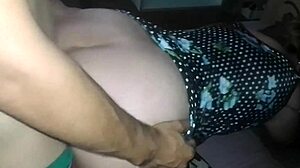 setting up the tripod for doggystyle pounding in her short floral dress outfit