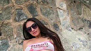 sexy petite brunette babe flashes bikini at public beach photoshoot