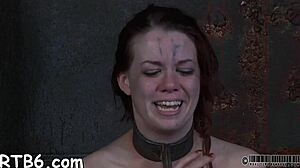 her tight cunt strains against the leather bonds begging for rough taming