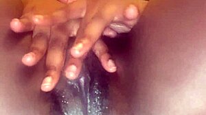 Dripping creamy black pussy lips spread wide for fingering fun