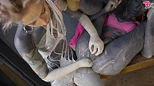 Tattooed dominatrix fists tranny ass gaping wide