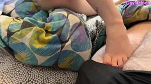 stepmom sneaks cheating handjob in bed while dirty talking husband on phone