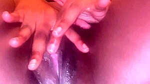 Dripping creamy black pussy lips spread wide for fingering fun