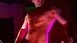 muscular studs stroke monster cocks in purple orange shadows handjob
