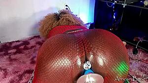 african bunz stuffs dildo up tight asshole in red skirt pov.