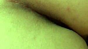 Brunette amateur shows naked ass legs feet in bed wearing white stockings close-up