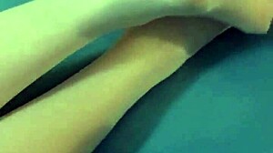 Brunette amateur shows naked ass legs feet in bed wearing white stockings close-up