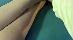 Brunette amateur shows naked ass legs feet in bed wearing white stockings close-up