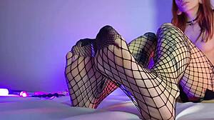 damn check out this skinny teen slut in fishnet stockings footjob