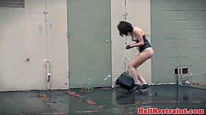 master binds sub in leather for garage vibrator punishment