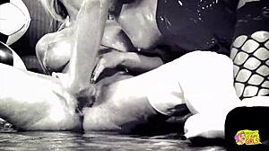 a couple of latex-clad sex bombs oil up and strap-on bang hard