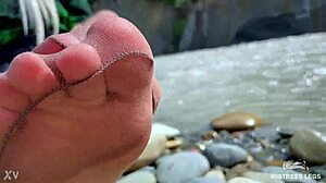 goddess teases her cute nylon soles and toes riverside in tan pantyhose 😍👣🌊 close-up foot fetish fun