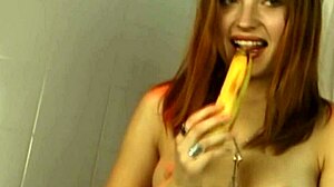 Horny redhead slut fucks juicy pussy with thick banana