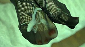 Blonde Milf Delivers Cum Drenched Footjob in Fishnets and Nylons