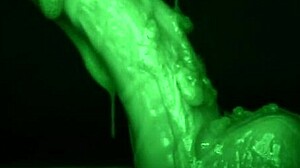 She strokes him sticky with slimy latex gloves dripping