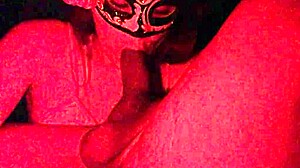 Masked Redhead Sucks Cock in Red Light Homemade