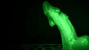 She strokes him sticky with slimy latex gloves dripping