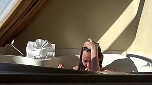 Cute asian teen teases in hot tub with fingering machine