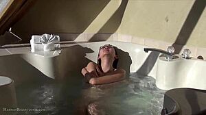 Cute asian teen teases in hot tub with fingering machine
